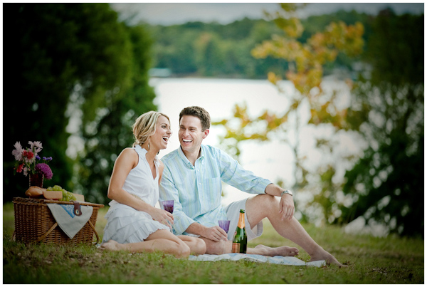photo of the happily engaged couple having a picnic at a waterfront park - photo by North Carolina based wedding photographers Cunningham Photo Artists